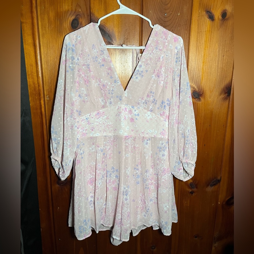 This pink floral romper! Has never need worn.